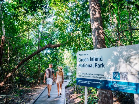 Couple waling into the National Park on Green Island