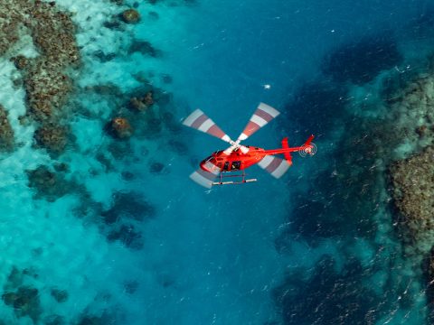 Aerial shot of Nautilus Helicopter over the Great Barrier Reef