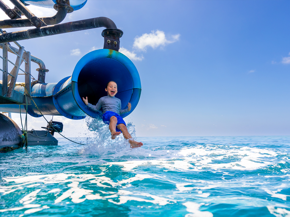 Boy on waterslide whilst on Sunlover Cruise