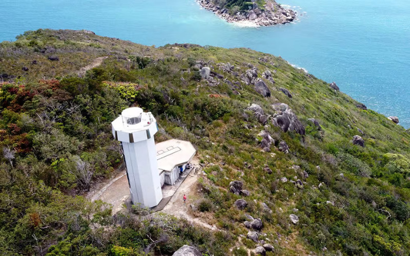 Fitzroy Island lighthouse on hill with coastal views over the Coral Sea