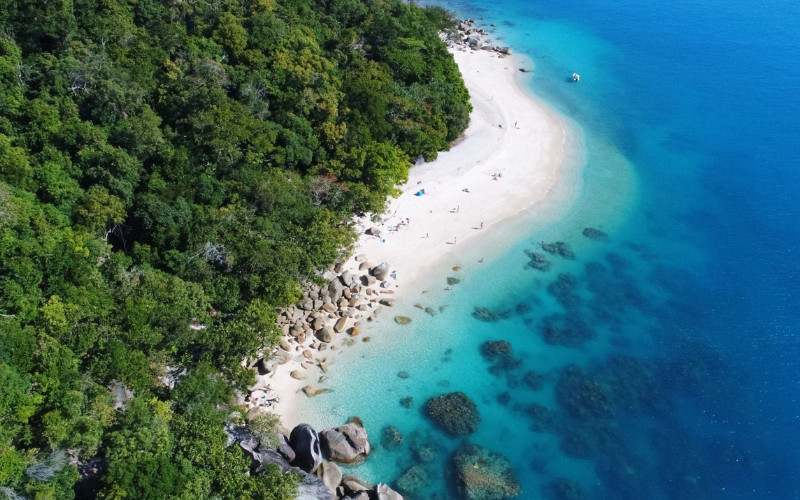 Aerial view of Nudey Beach on Fitzroy Island with white sand and turquoise water