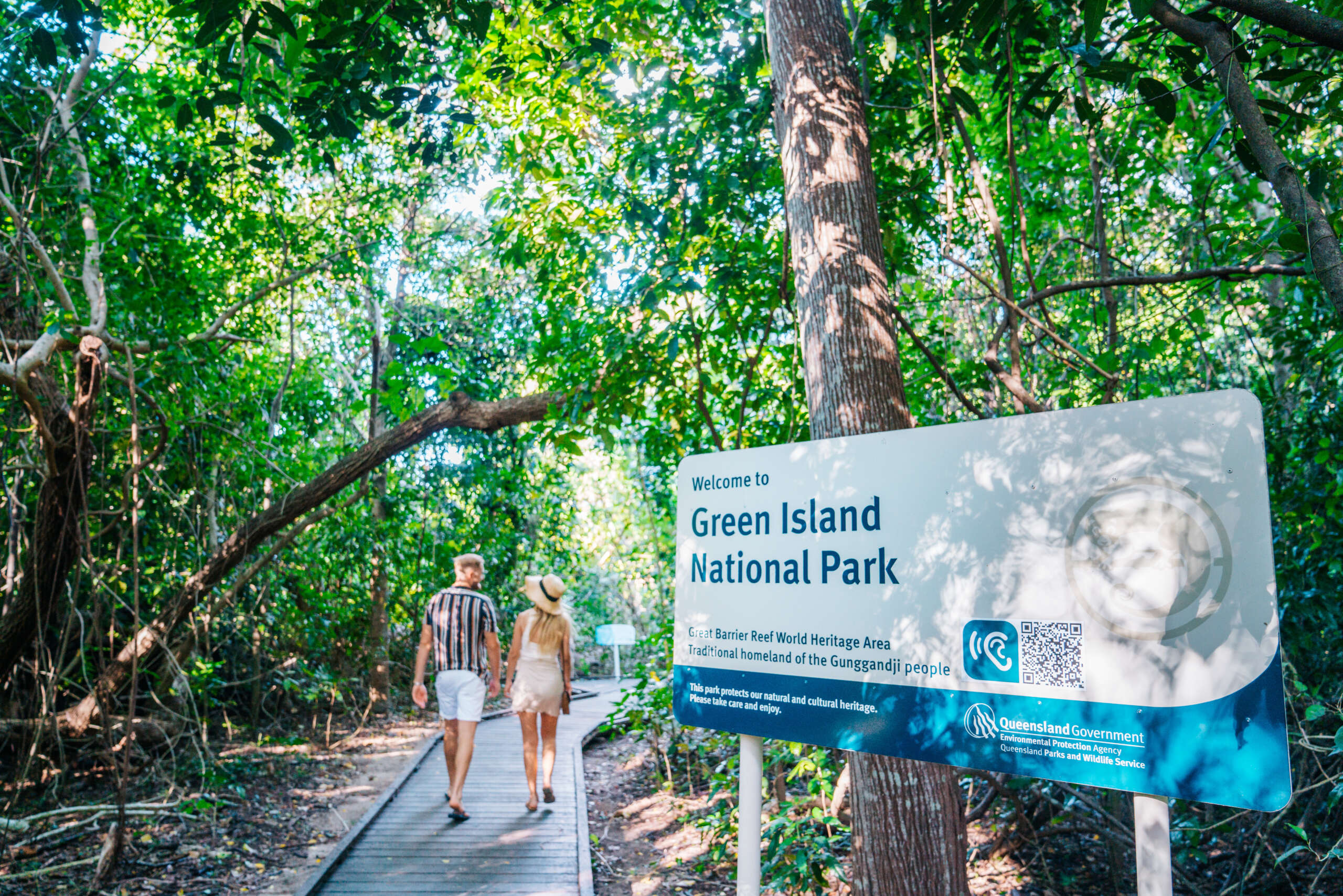 Visitors walking through rainforest at Green Island National Park near Cairns