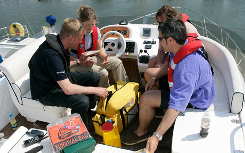 Reef tour crew providing first aid assistance on a boat at the Great Barrier Reef