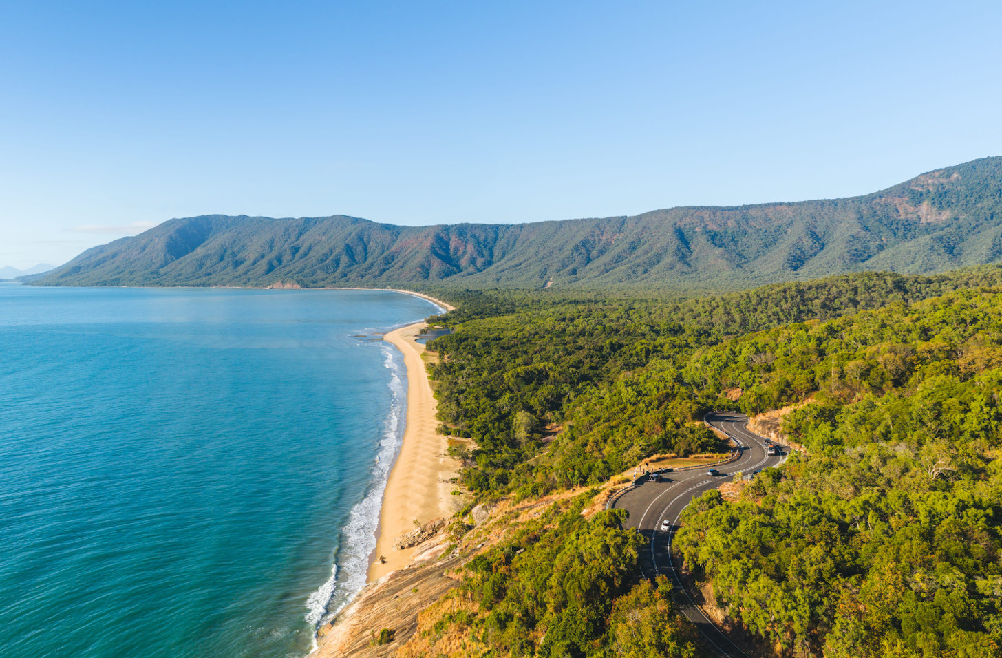 Scenic coastal road between Cairns and Daintree Rainforest with mountain and ocean views Queensland
